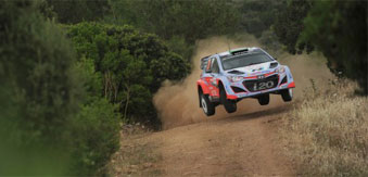 Rally car jump on dirt road